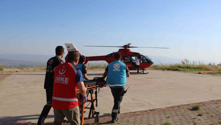 Dağlık alana düşen paraşütçü ambulans helikopterle hastaneye sevk edildi